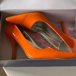Orange pumps